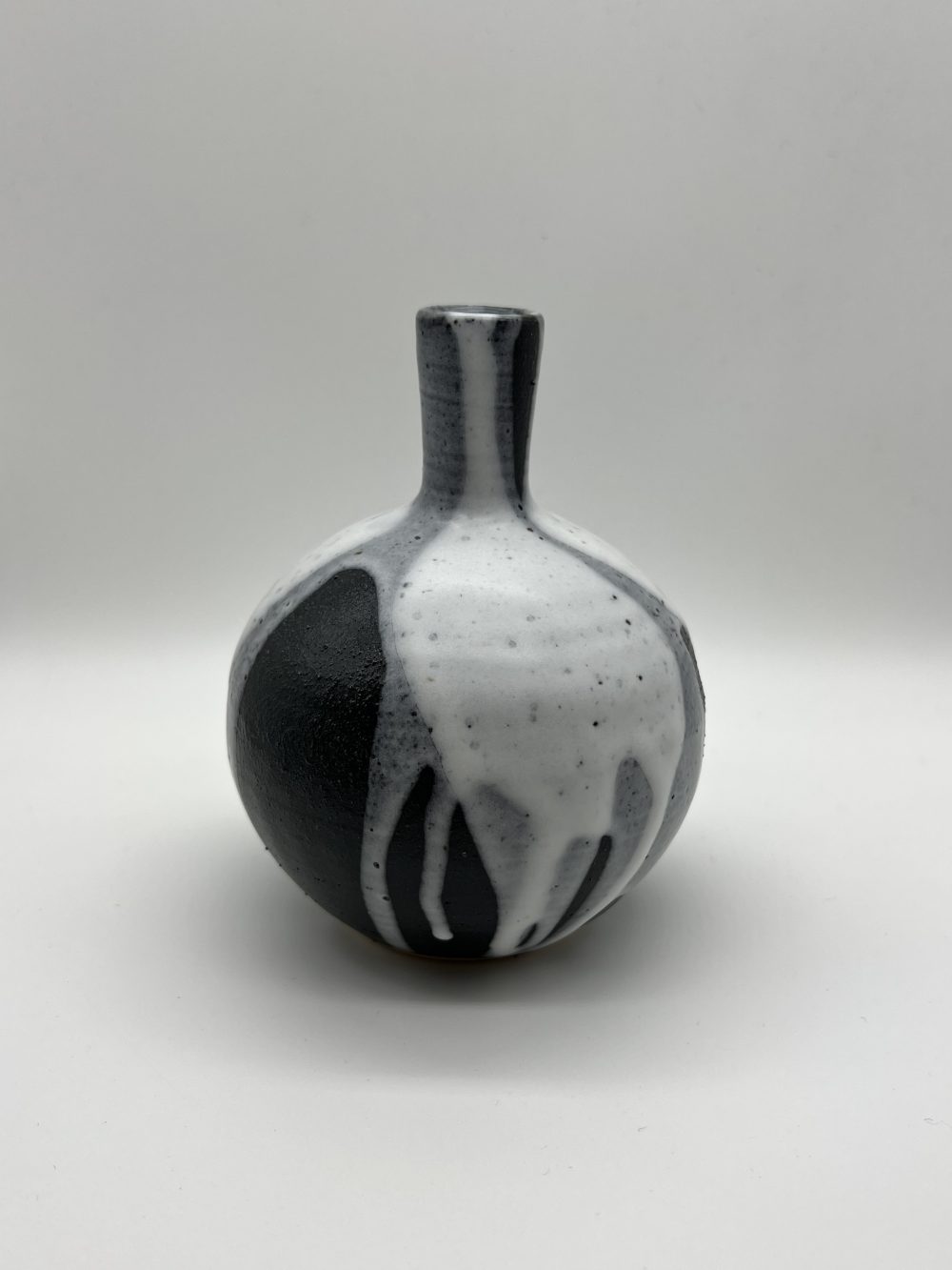 Poured Black and White Vase, stoneware vase by Illyria Pottery